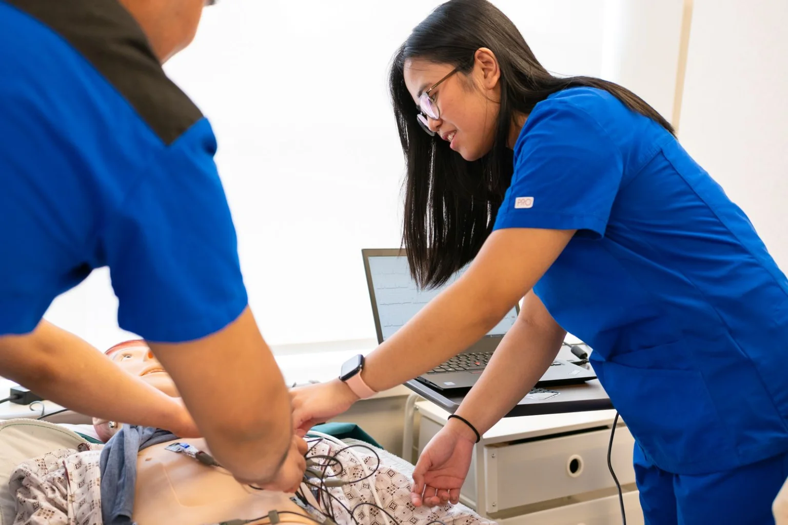 Nursing students practicing clinical skills in a simulation lab