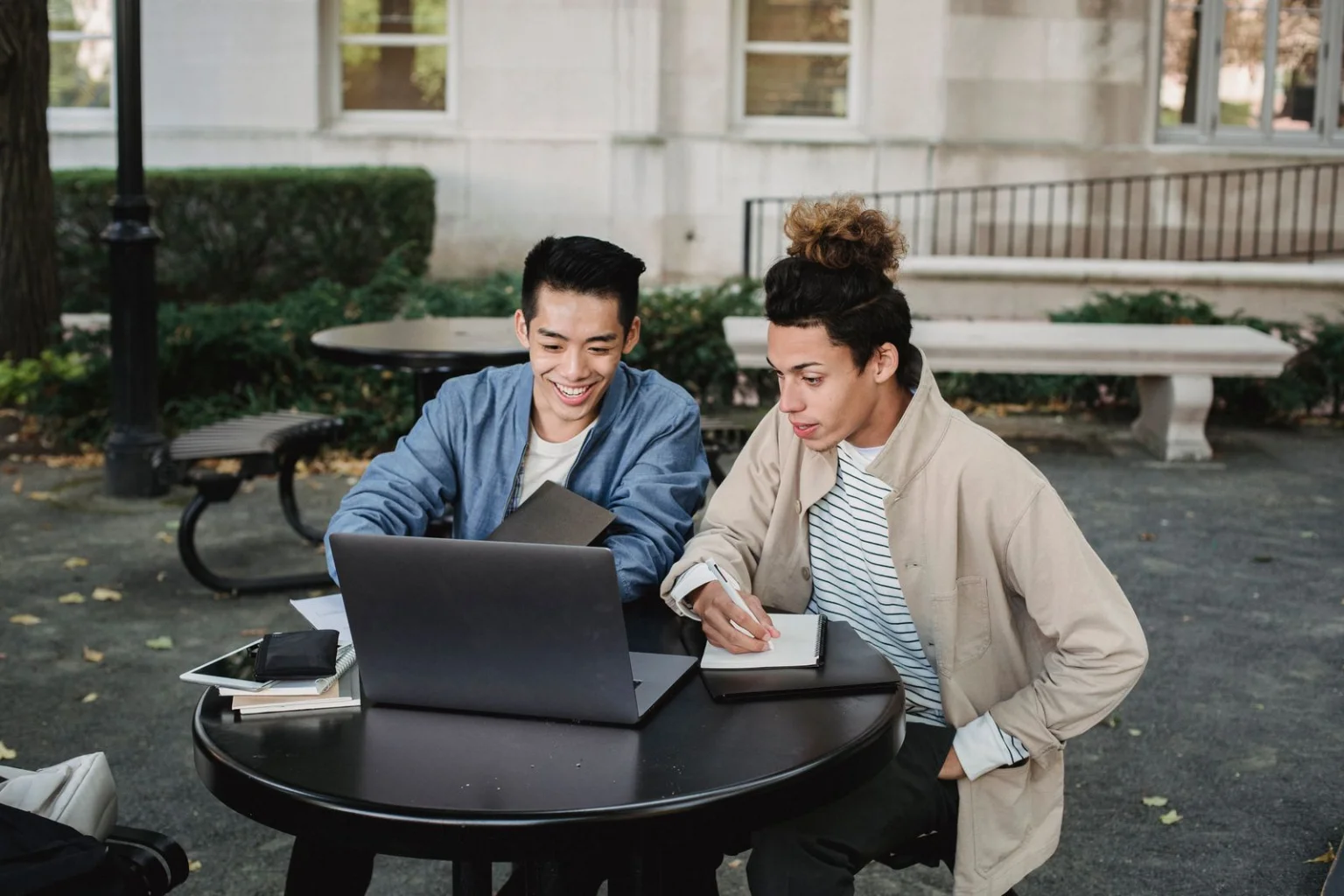 International nursing students studying together with a laptop